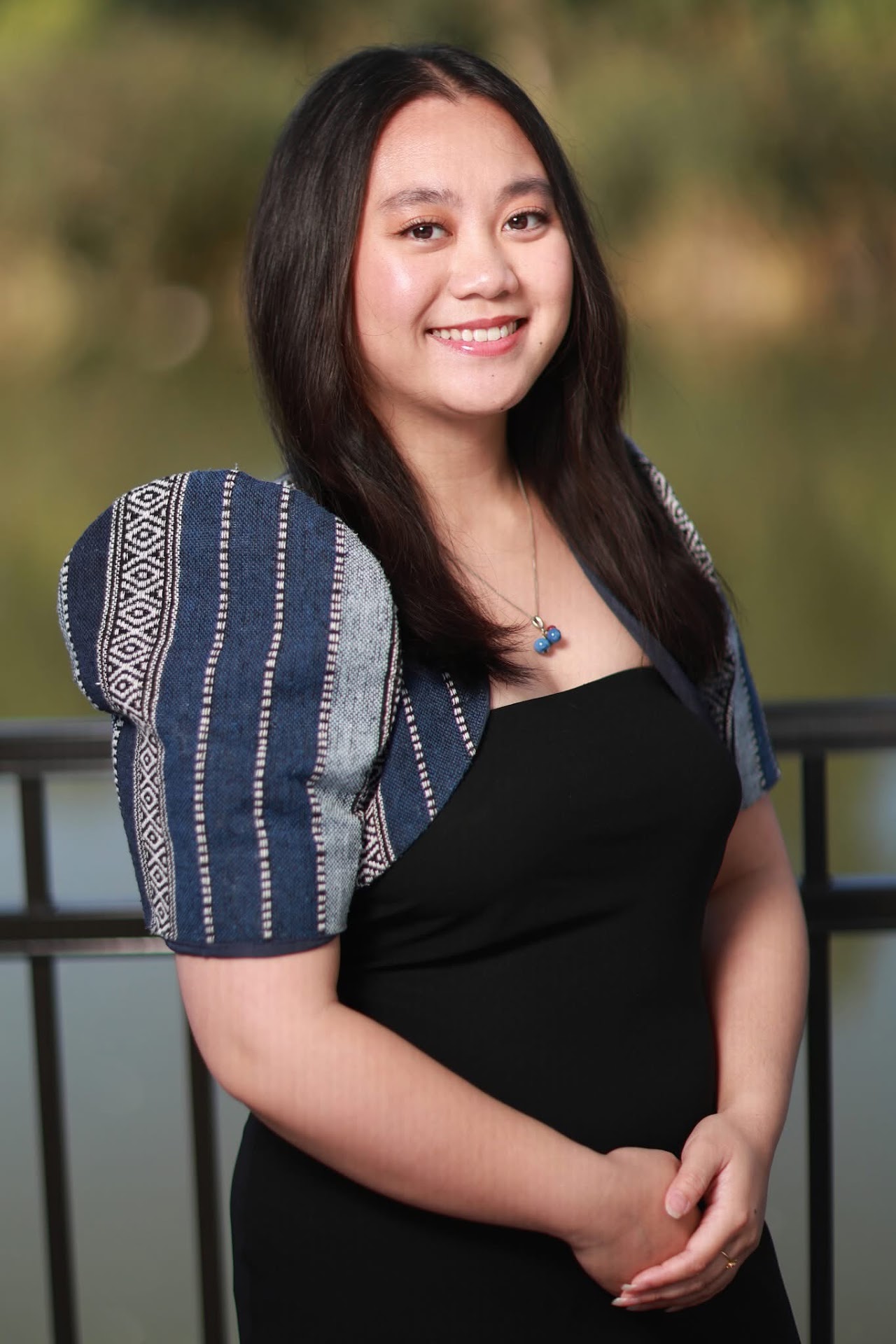 Khrizza Manalastas wearing a dark blue striped traditional-inspired top.