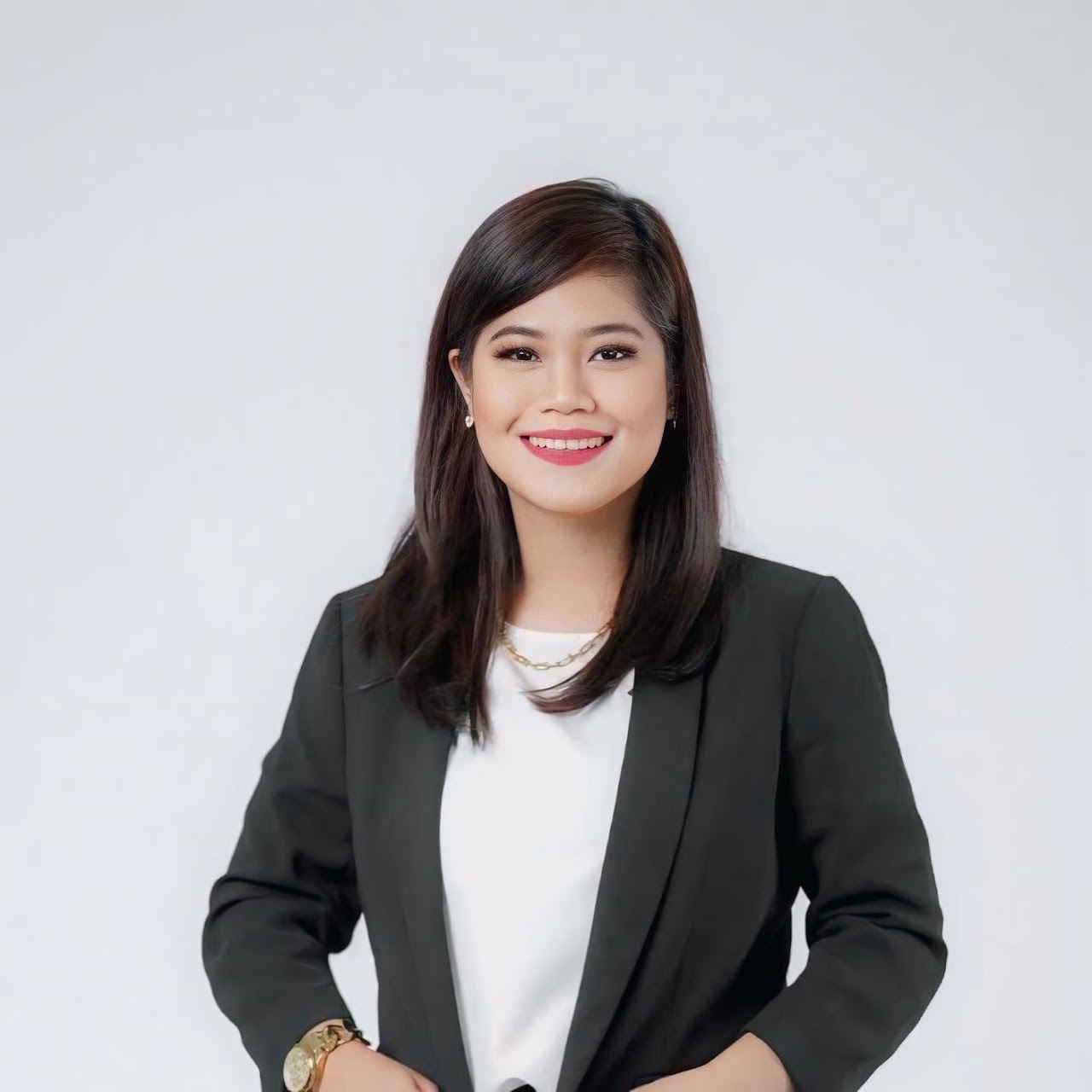Mia Ancog in a professional portrait wearing a black blazer.